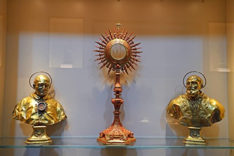 Golden monstrance and holy figures