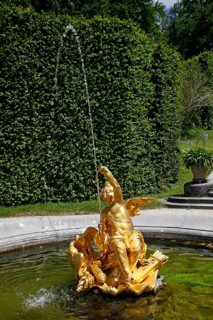 Fountain figure love god Cupid with bow and arrow
