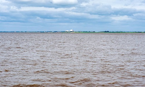 In the back Brokdorf nuclear power plant at the river Elbe