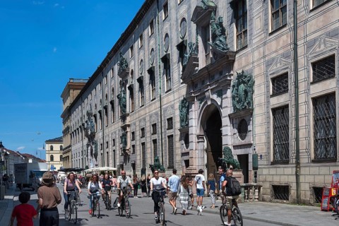 West front of the Residenz with Residenzstrasse and cyclists