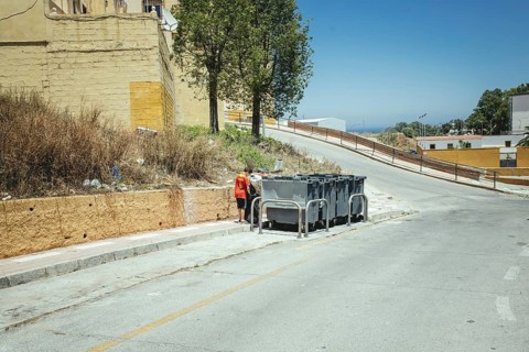 Underage migrant searching in rubbish bins