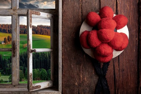 Rustic farmhouse parlor with Bollen hat and view out of the window into the landscape