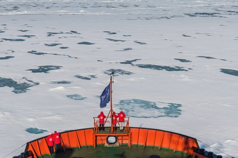 Tourists watching the ice breaking on board of an icebreaker