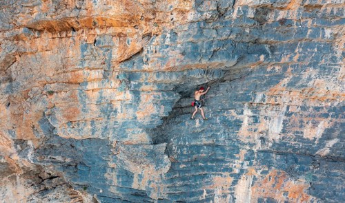 Climber climbing on a rock face