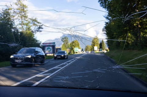 Shattered windscreen due to hailstones on a car
