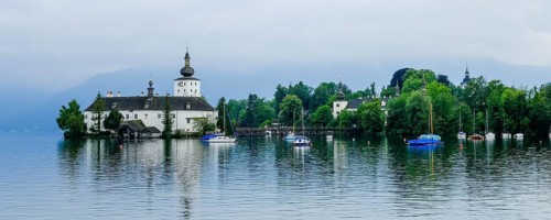 Orth Castle on Lake Traun in Gmunden with boats