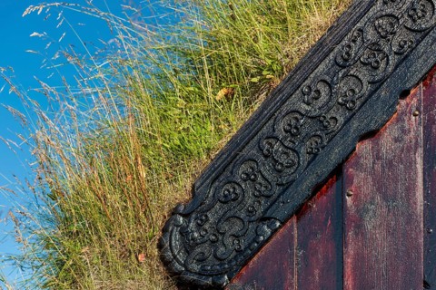 Panel and grass roof decorated with carvings