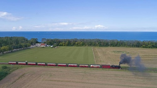 Steam train Molli at the sea buckthorn beach