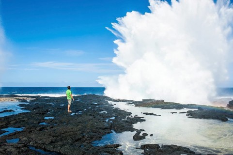 Tourist enjoying the huge waves in the Alofaaga blowholes on the south of SavaiÂ´i