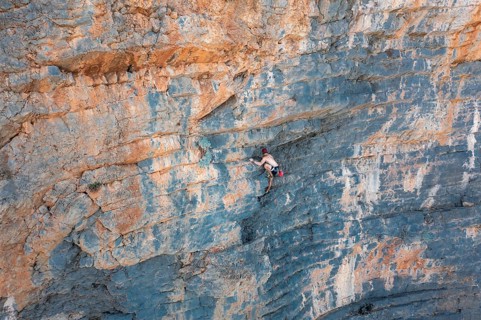 Climber climbing on a rock face