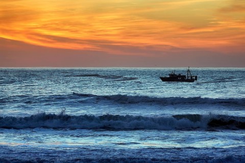 Fishing boat in the surf