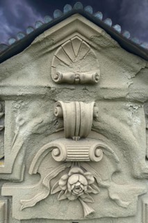 Ornaments and symbol of a rose on a gravestone