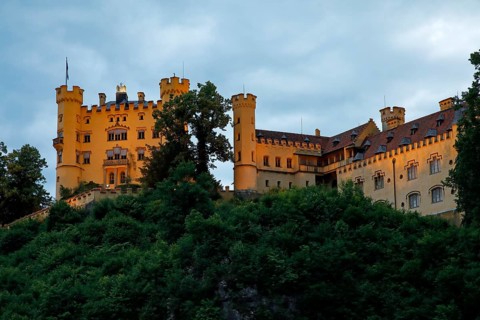 Illuminated castle Hohenschwangau in the evening light