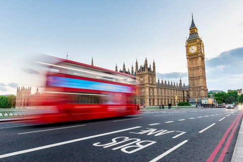 Red double-decker bus on the Westminster Bridge