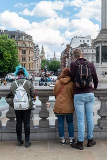 Young people standing in Trafalgar Square