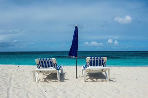 Sun loungers on world class Shoal Bay East beach