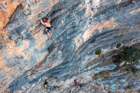 Climber climbing on a rock face
