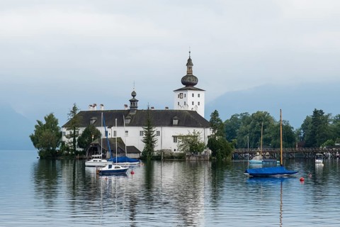Orth Castle on Lake Traun in Gmunden with boats