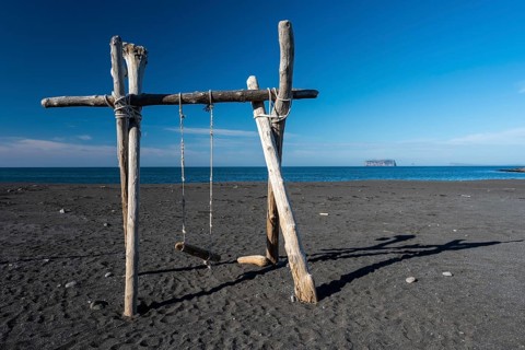 Swing made of driftwood