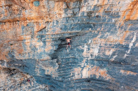 Climber climbing on a rock face