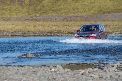 SUV driving through ford Geirlandsa river