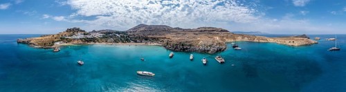 Sailboats anchoring in front of Lindos