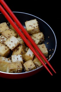 Fried tofu cubes in pan