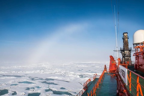 Fog bow or white rainbow in the ice around the North Pole