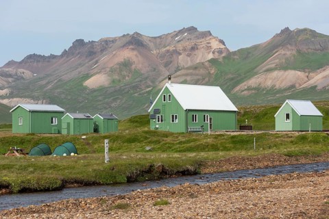 Cabins of the Icelandic Hiking Association and coloured rhyolite mountains