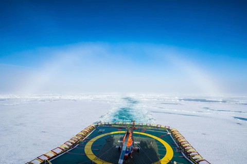 Fog bow or white rainbow in the ice around the North Pole