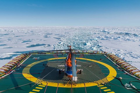 Helicopter on the Helipad of the Icebreaker '50 years of victory' on its way to the North Pole breaking through the ice