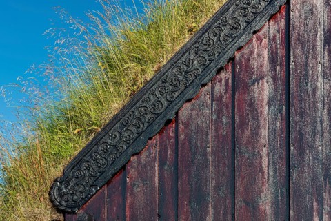 Panel and grass roof decorated with carvings