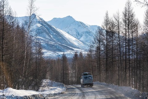 Minivan driving on the Road of Bones