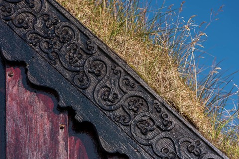 Panel and grass roof decorated with carvings