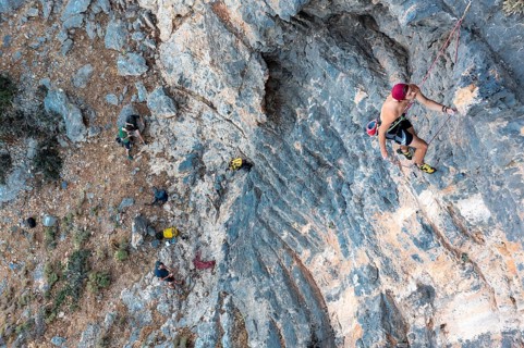 Climber climbing on a rock face