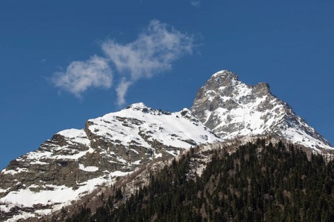 Snowcapped mountains against blue sky