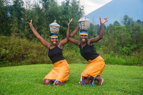 Woman carrying a basket on her hat at a ceremony of former poachers