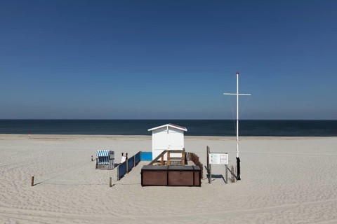 Deserted beach with lifeguard hut