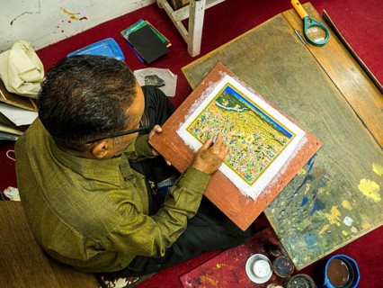 Artist creates traditional miniature painting