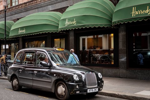 Black London Taxi outside the luxury department stores