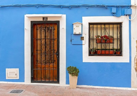 Close-up of door and window of blue fishermen's houses in Villajoyosa