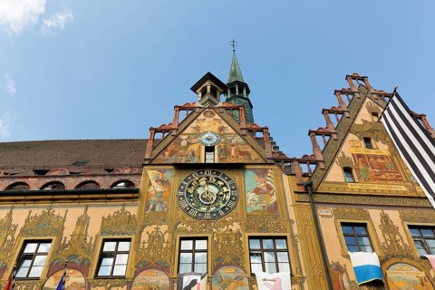 Richly decorated astronomical clock with signs of the zodiac on the town hall