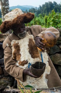 Old man preparing local herbs on a Ceremony of former poachers