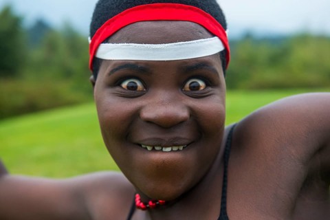 Woman starring at the camera at a ceremony of former poachers