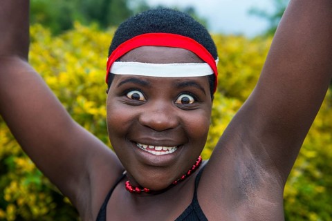 Woman starring at the camera at a ceremony of former poachers