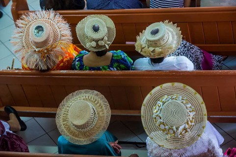 Women with traditional hats on a church service