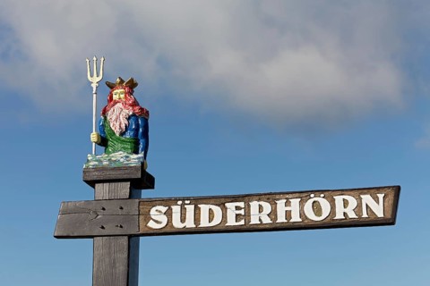Original street sign with carved figure
