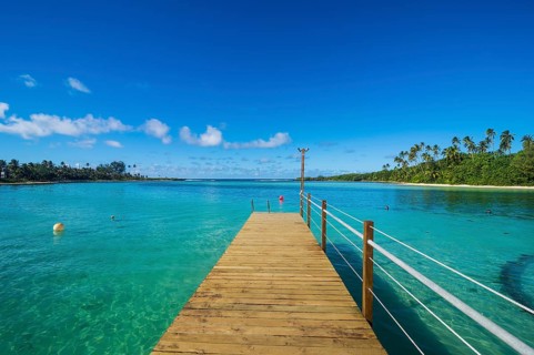 Pier in the turquoise waters of Muri beach