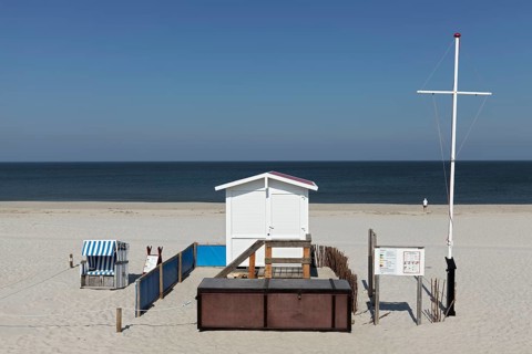 Deserted beach with lifeguard hut