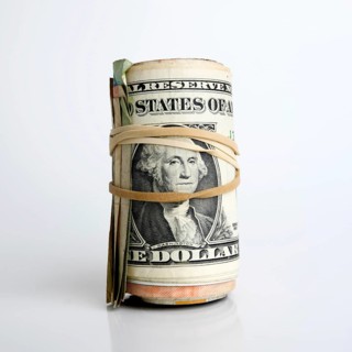 Roll of dollar banknotes